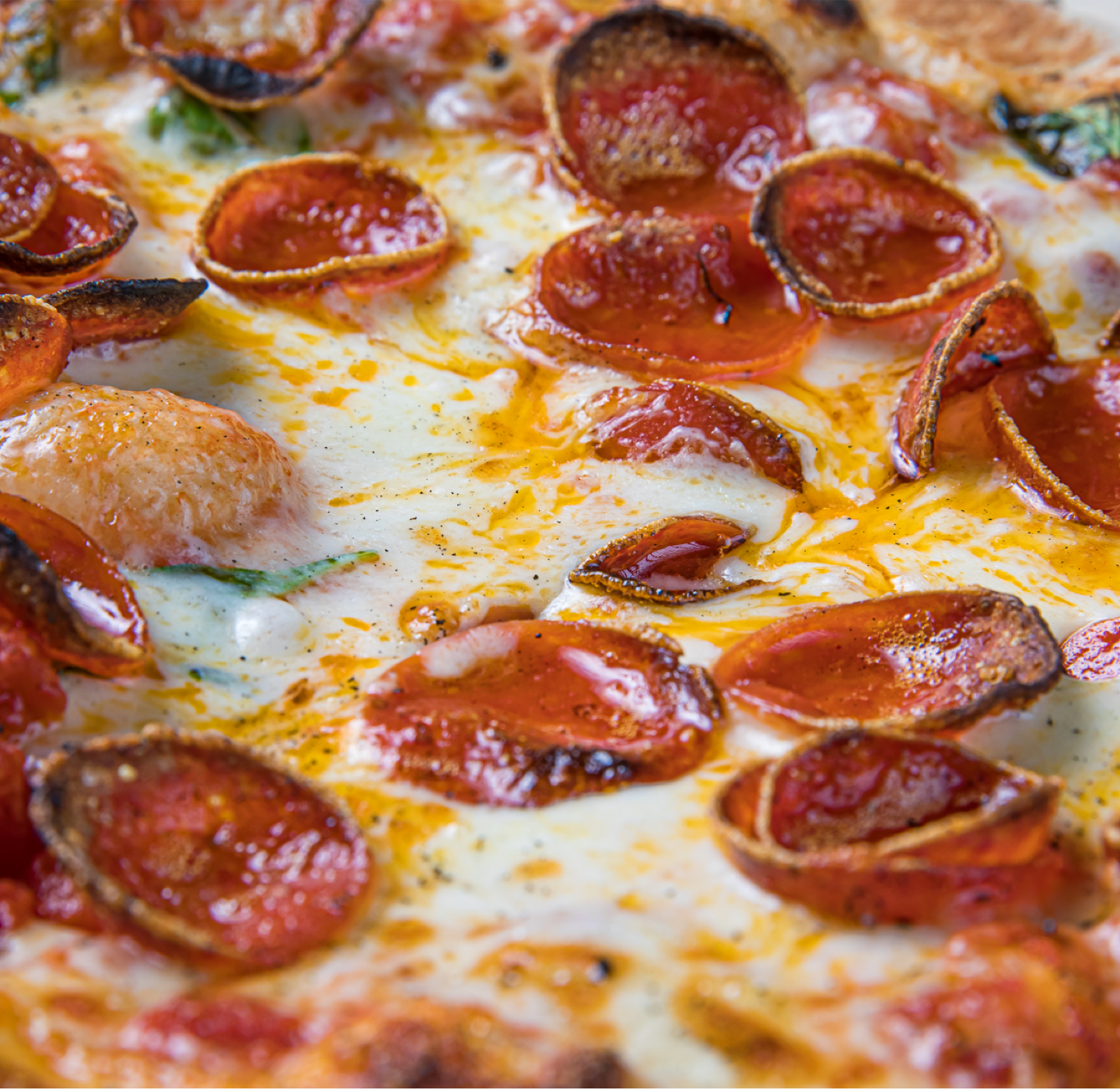Close up of pepperoni on pizza