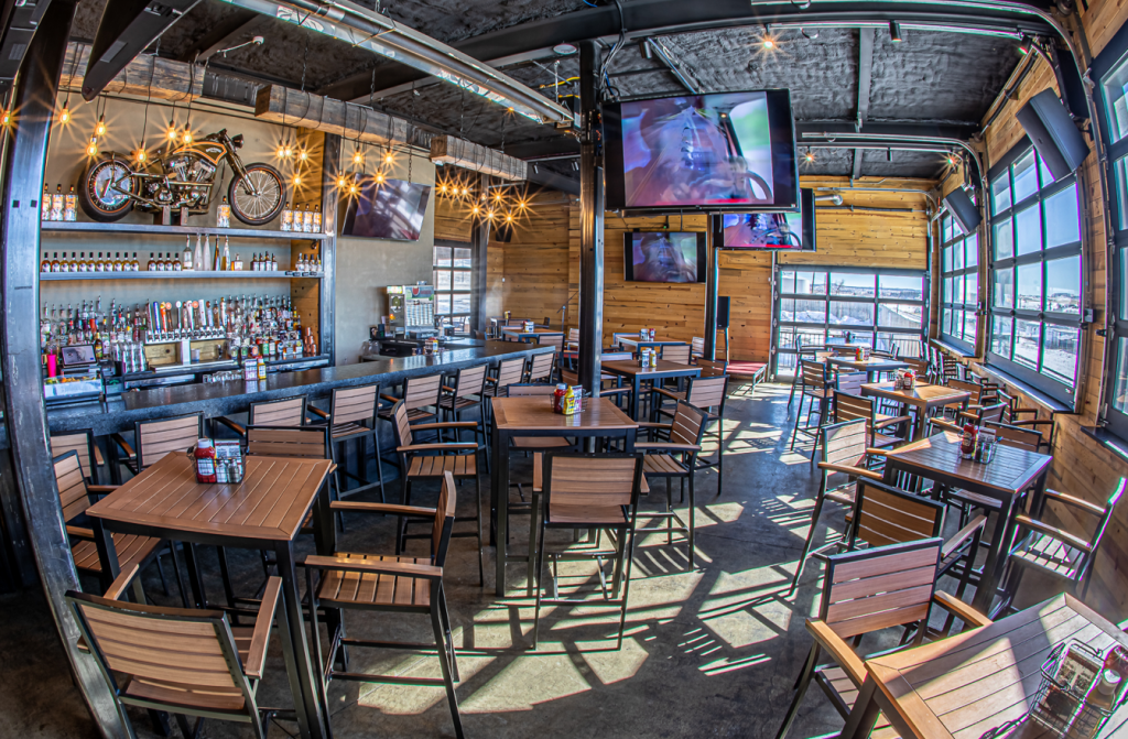 Wide Open Saloon interior with tables, great views, and sports on the television- Sedalia Room