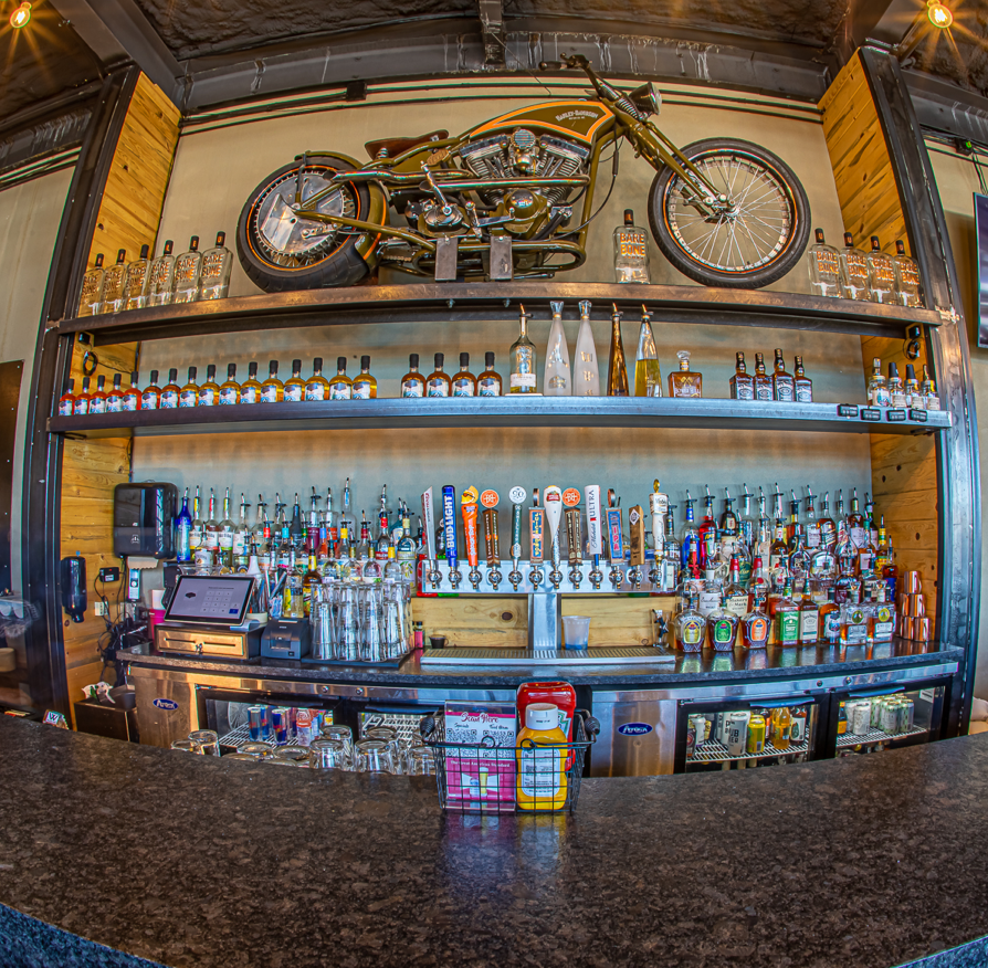 Wide Open Saloon bar with a motorcycle on the wall- Sedalia Room
